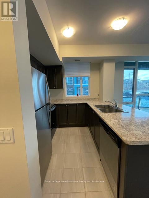140 - 16 Concord Place, Grimsby (Grimsby Beach), ON - Indoor Photo Showing Kitchen With Double Sink