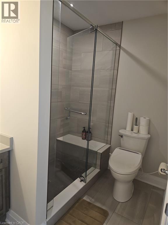 Bathroom with a stall shower and vanity - 249 Grey Silo Road Unit# 301, Waterloo, ON - Indoor Photo Showing Bathroom
