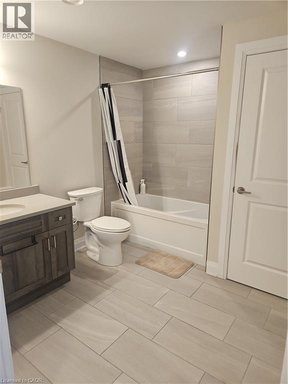 Full bathroom with shower / tub combo, vanity, and recessed lighting - 249 Grey Silo Road Unit# 301, Waterloo, ON - Indoor Photo Showing Bathroom
