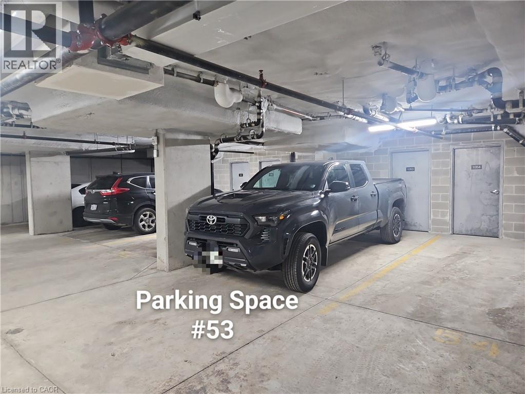 View of parking deck - 249 Grey Silo Road Unit# 301, Waterloo, ON - Indoor Photo Showing Garage