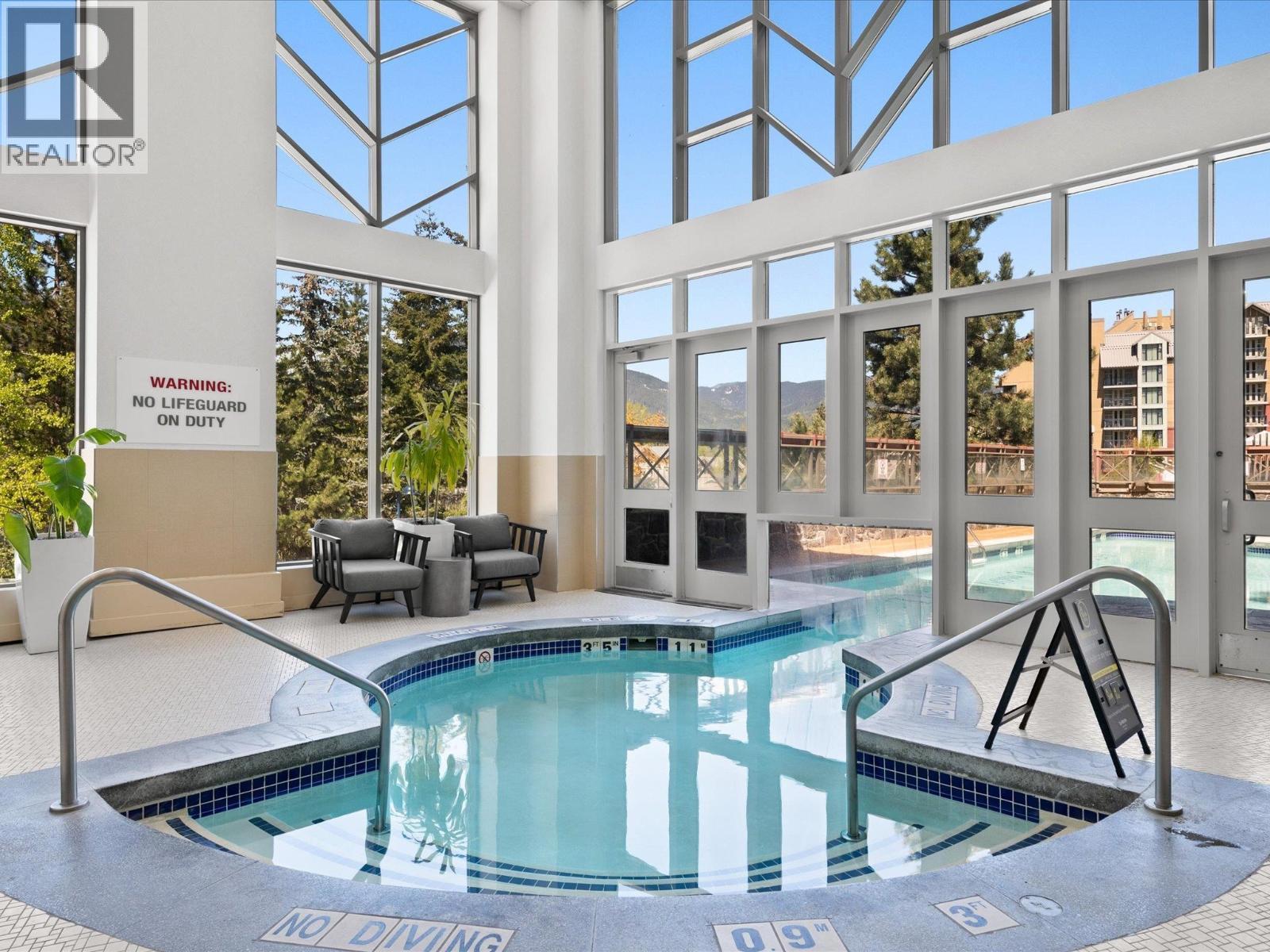 516 4090 Whistler Way, Whistler, BC - Photo Showing Other Room With In Ground Pool