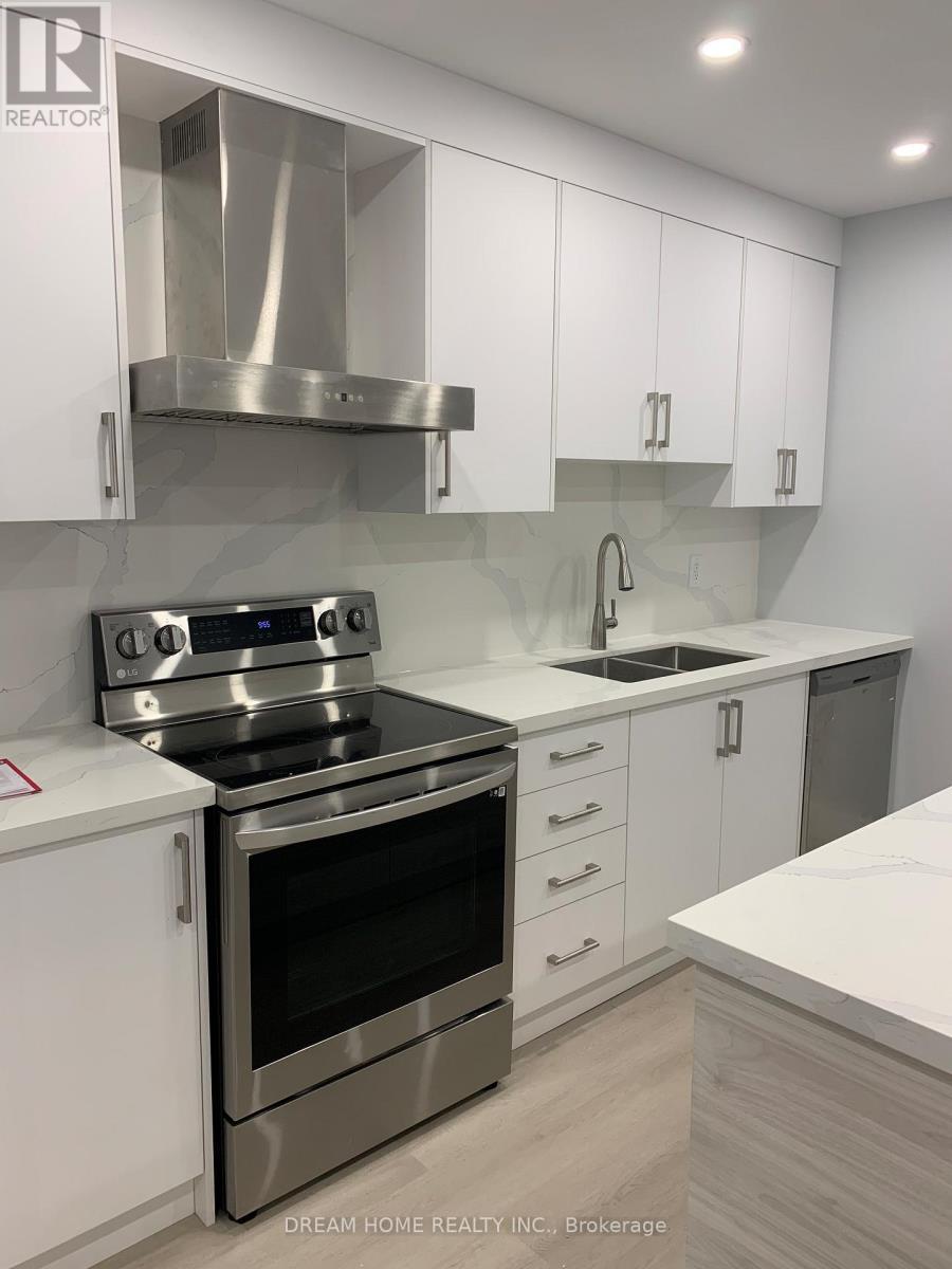 101 - 12 Mansfield Avenue, Toronto, ON - Indoor Photo Showing Kitchen With Double Sink