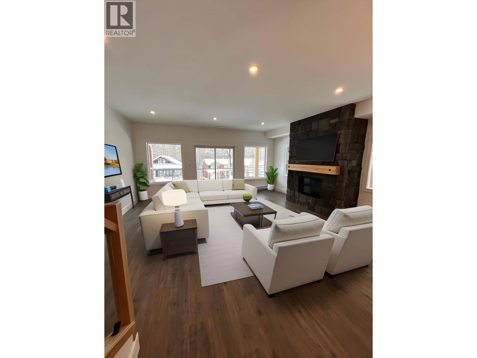 1367 Burfield Drive, Sun Peaks, BC - Indoor Photo Showing Living Room With Fireplace