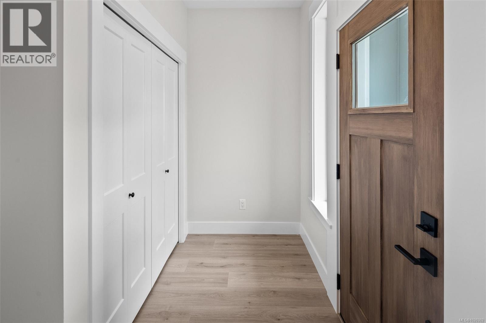 Corridor with light wood-style floors and baseboards - A 6521 Noblewood Pl, Sooke, BC - Indoor Photo Showing Other Room