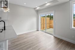 Unfurnished dining area featuring recessed lighting, light wood-type flooring, and a chandelier -