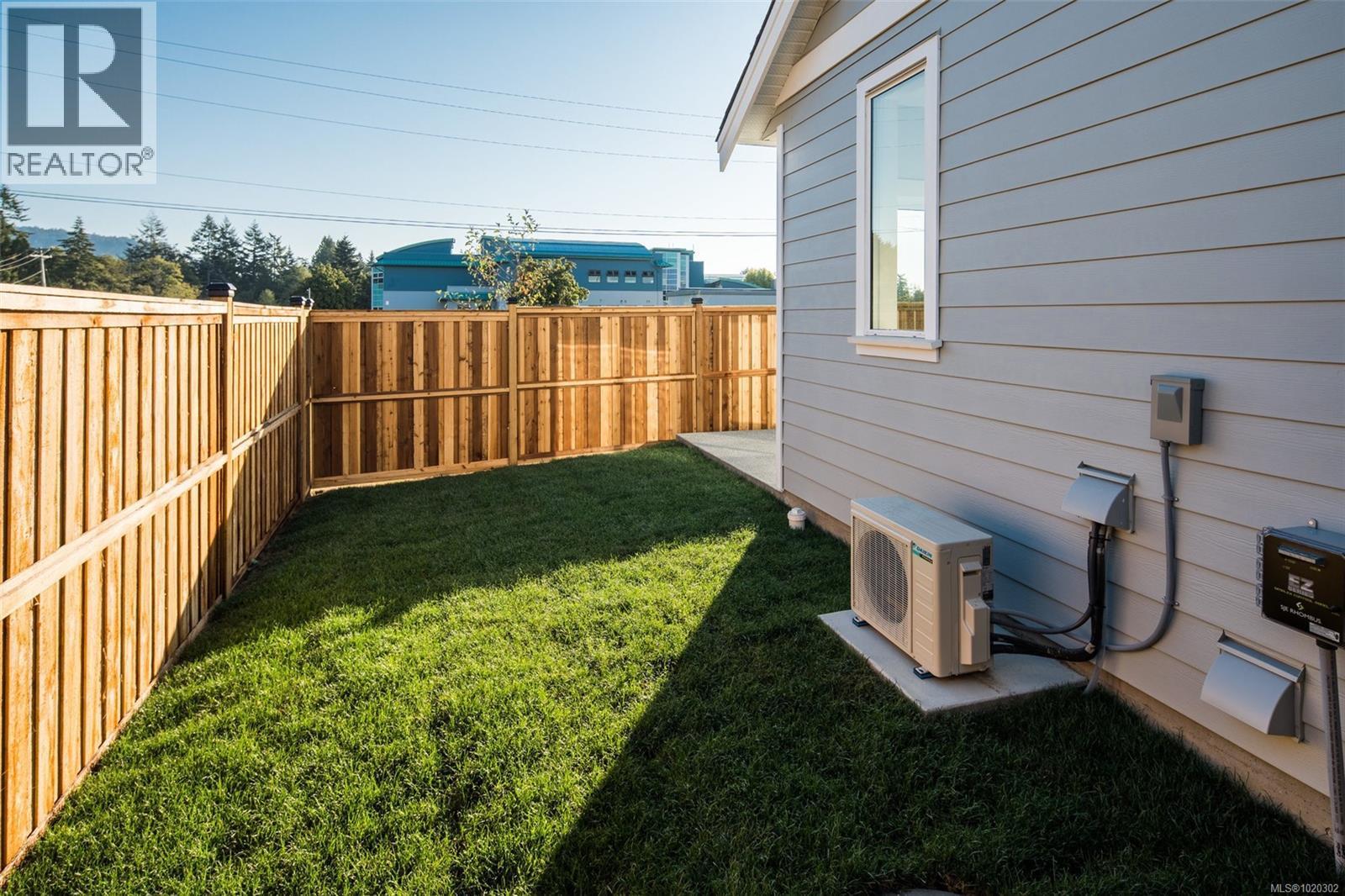 View of fenced backyard - A 6521 Noblewood Pl, Sooke, BC - Outdoor With Exterior