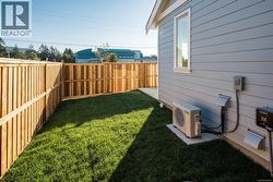 View of fenced backyard -