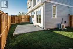 Fenced backyard featuring a patio -