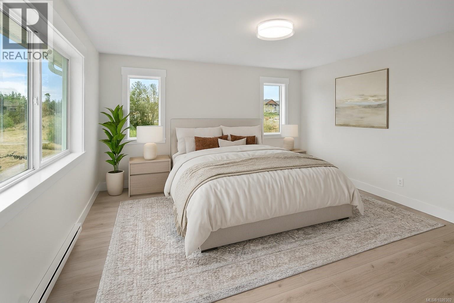 Bedroom with a baseboard heating unit and light wood-style flooring - A 6521 Noblewood Pl, Sooke, BC - Indoor Photo Showing Bedroom