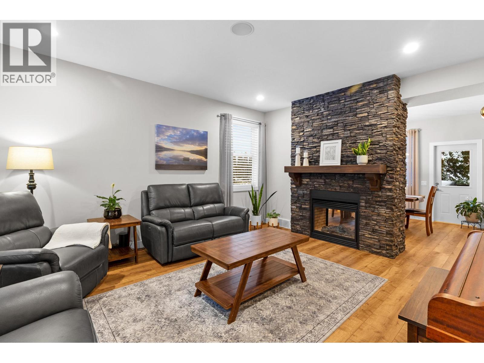 Living room - 13265 Apex Drive, Lake Country, BC - Indoor Photo Showing Living Room With Fireplace