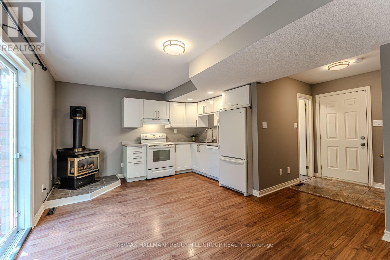 239 Simcoe Street, Clearview, ON - Indoor Photo Showing Kitchen With Fireplace