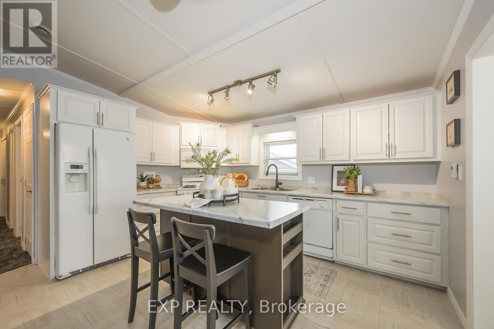 51 - 22790 Amiens Road, Middlesex Centre, ON - Indoor Photo Showing Kitchen With Double Sink