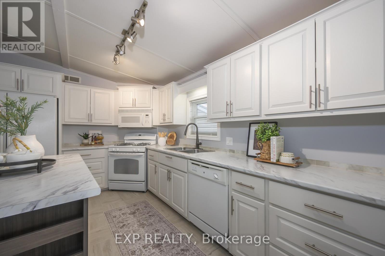 51 - 22790 Amiens Road, Middlesex Centre, ON - Indoor Photo Showing Kitchen With Double Sink