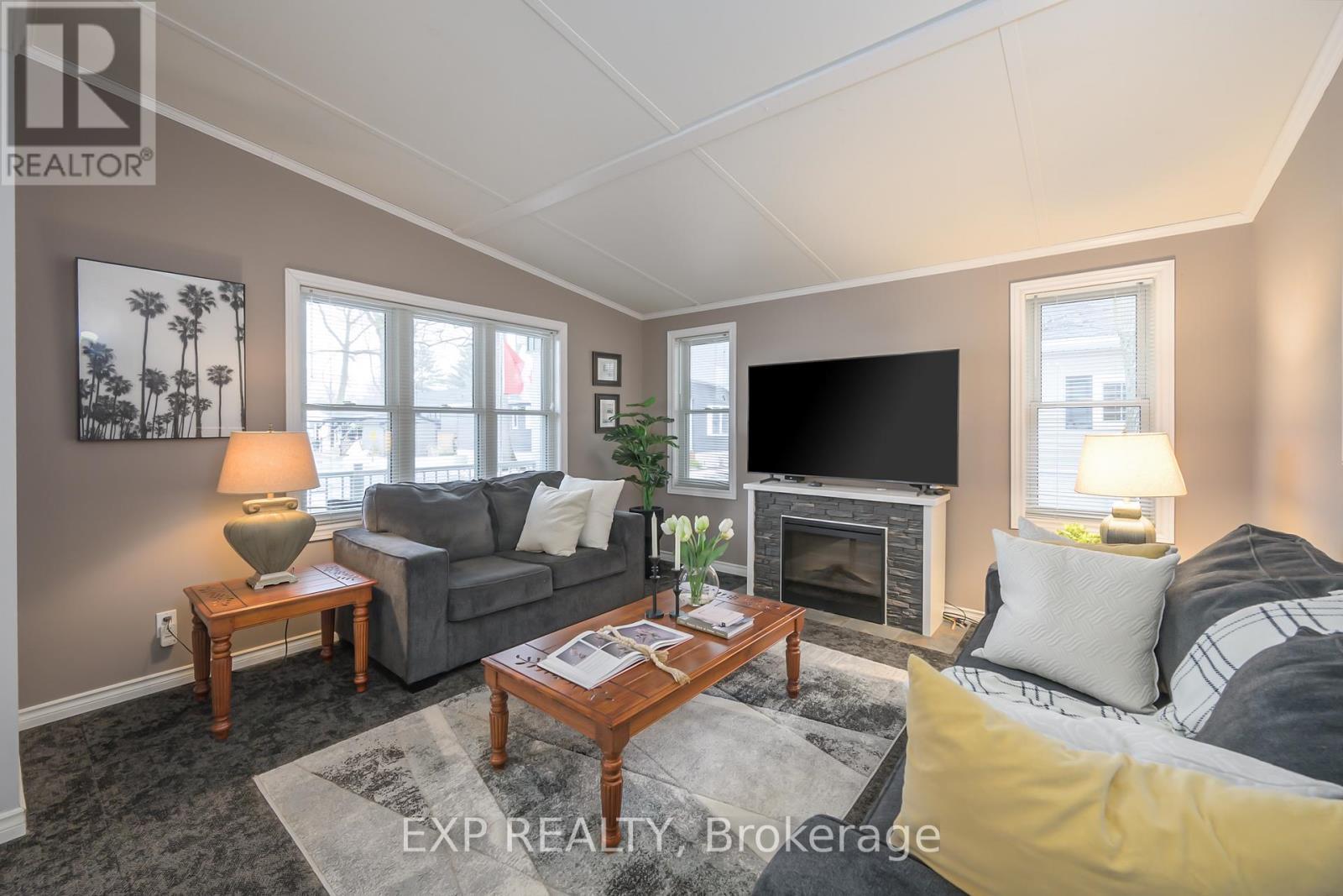 51 - 22790 Amiens Road, Middlesex Centre, ON - Indoor Photo Showing Living Room With Fireplace