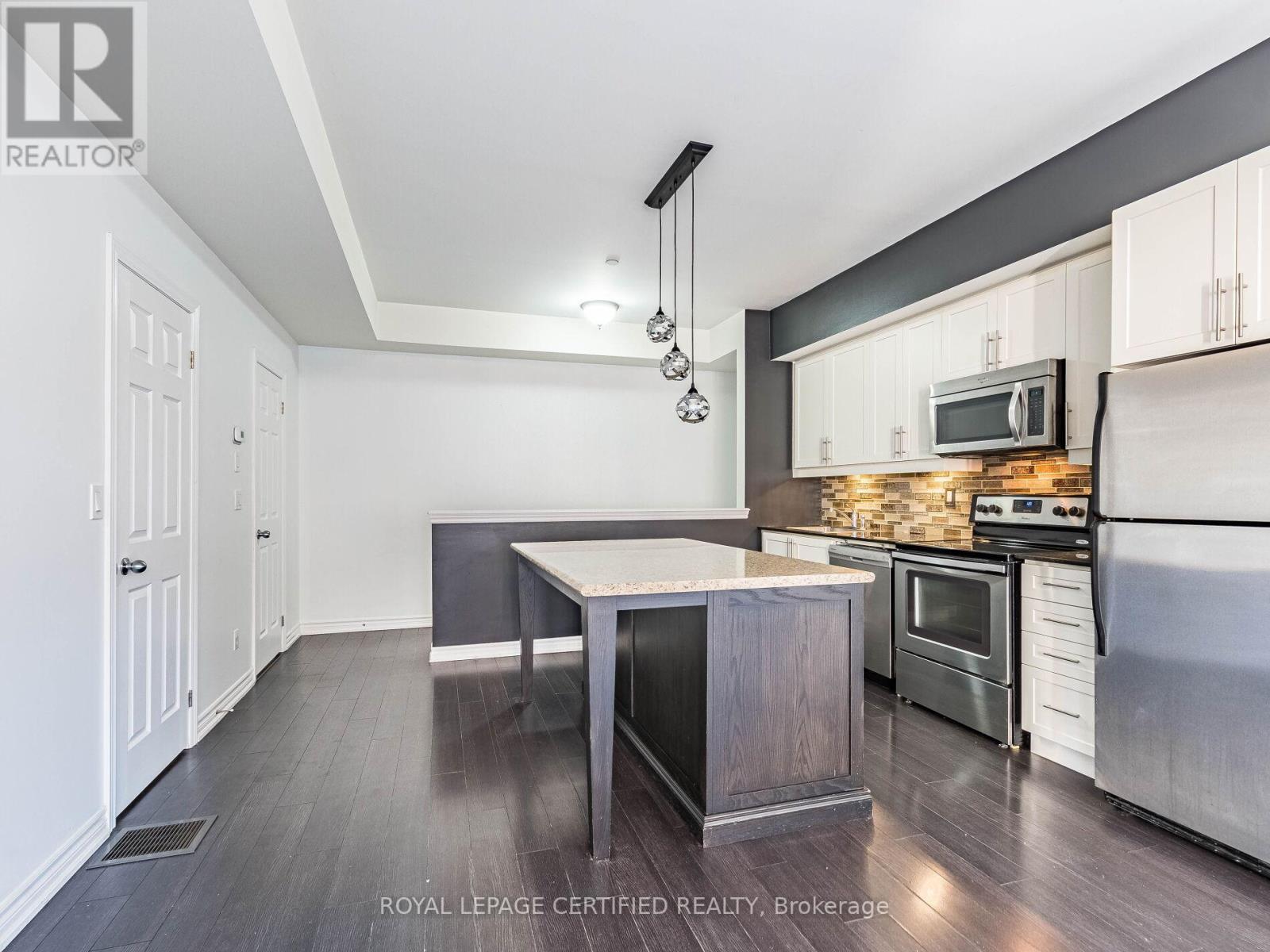104 - 30 Carnation Avenue, Toronto, ON - Indoor Photo Showing Kitchen