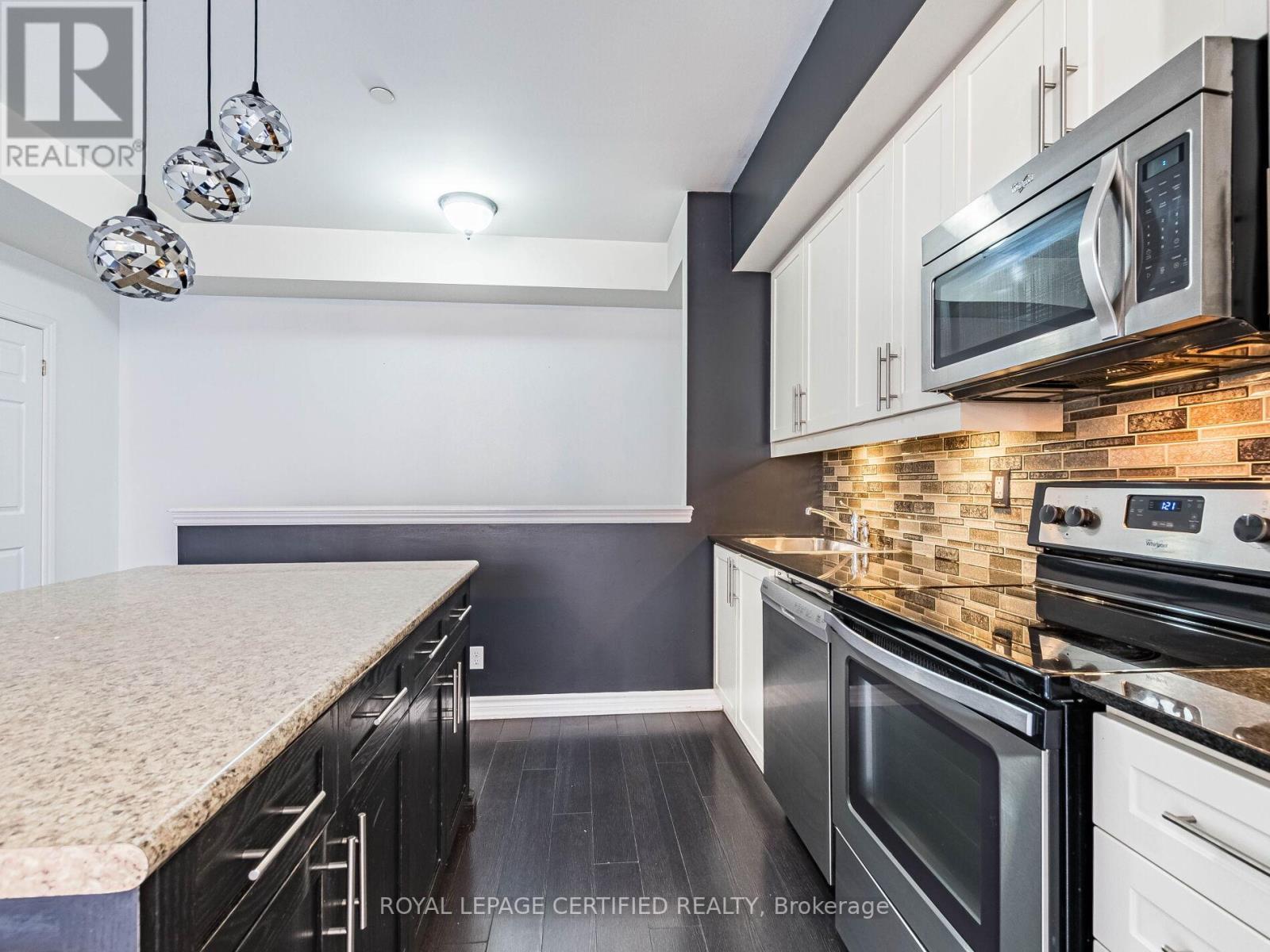 104 - 30 Carnation Avenue, Toronto, ON - Indoor Photo Showing Kitchen With Upgraded Kitchen