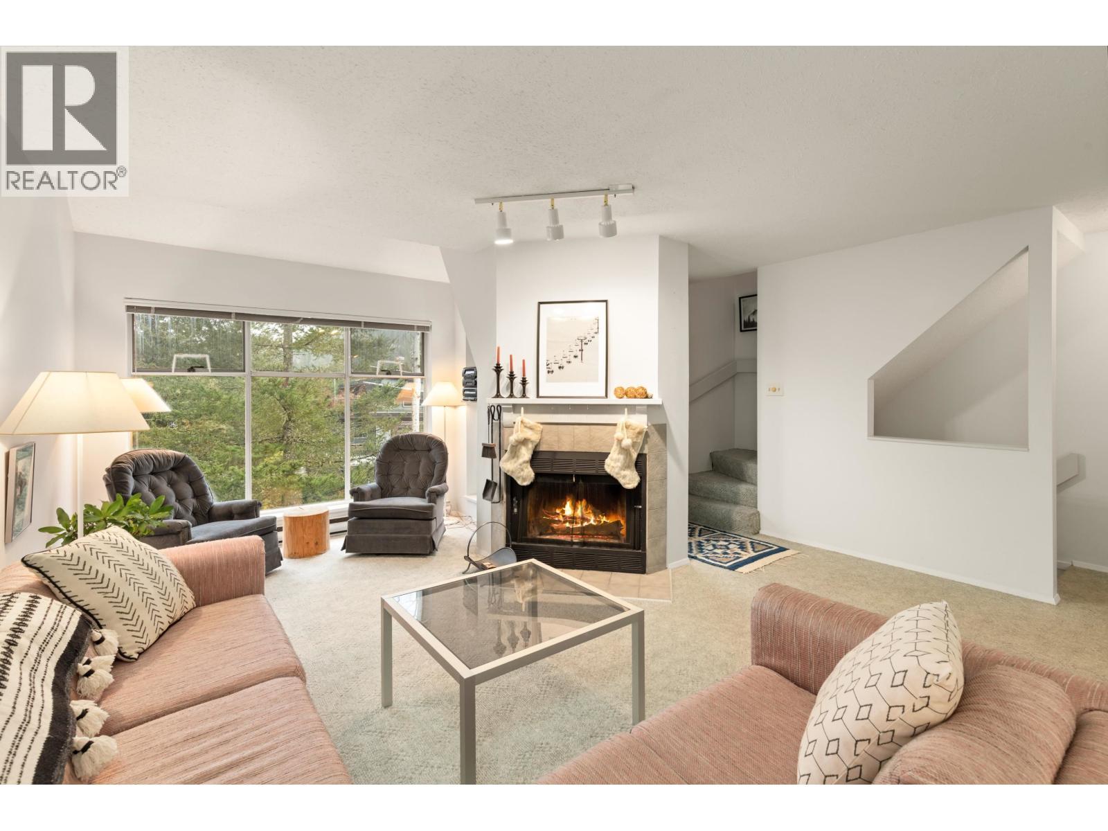 4 2134 Timber Ridge, Whistler, BC - Indoor Photo Showing Living Room With Fireplace