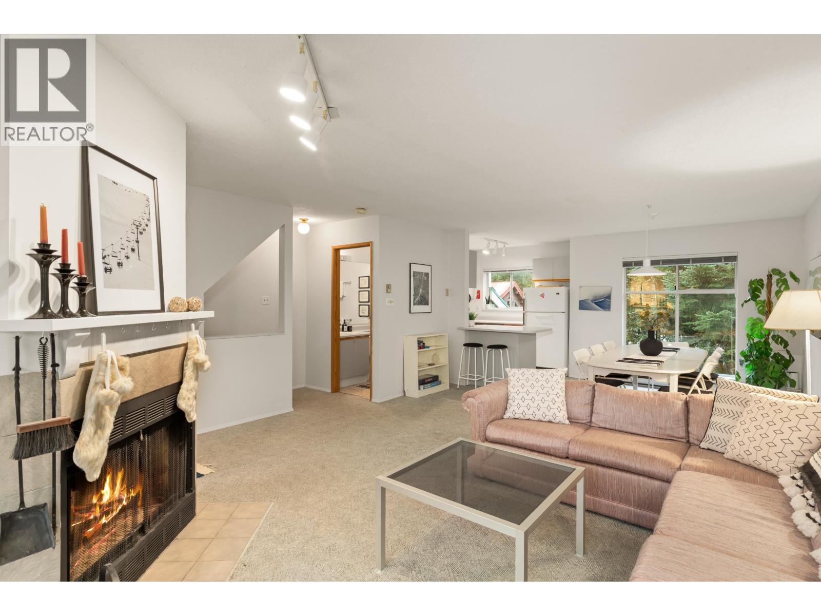 4 2134 Timber Ridge, Whistler, BC - Indoor Photo Showing Living Room With Fireplace