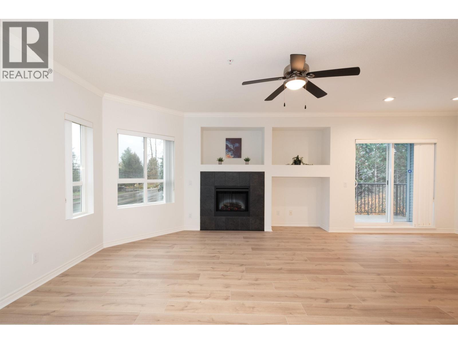 202 12090 227 Street, Maple Ridge, BC - Indoor Photo Showing Other Room With Fireplace