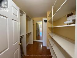 Primary Bedroom Walk In Closet -