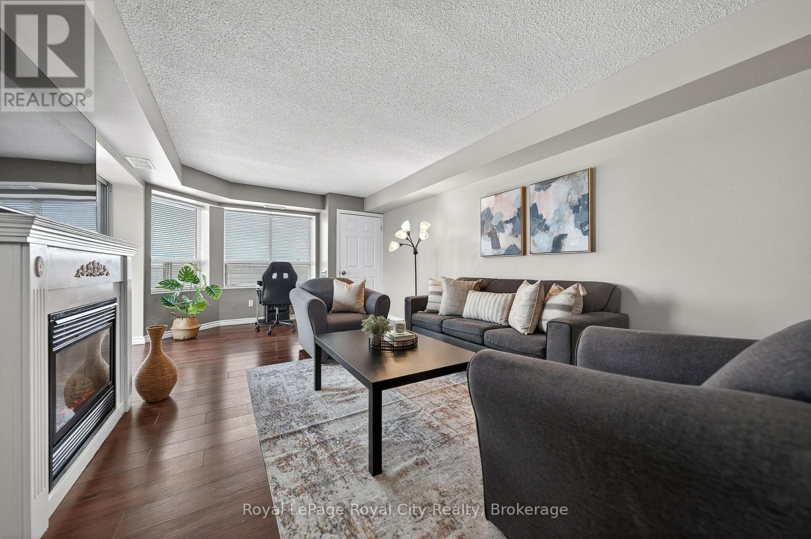 701 - 281 Bristol Street, Guelph (Junction/Onward Willow), ON - Indoor Photo Showing Living Room With Fireplace
