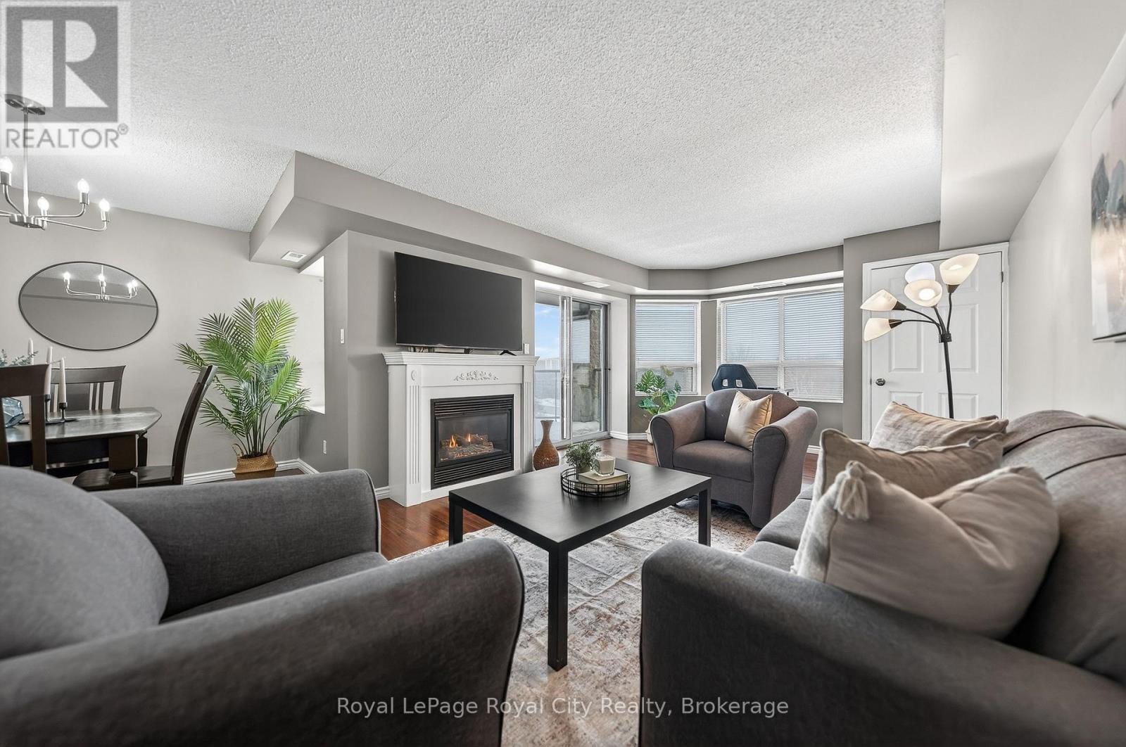 701 - 281 Bristol Street, Guelph (Junction/Onward Willow), ON - Indoor Photo Showing Living Room With Fireplace