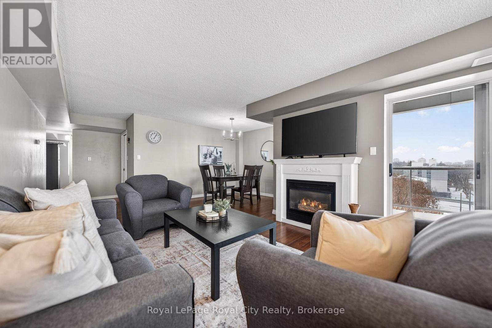 701 - 281 Bristol Street, Guelph (Junction/Onward Willow), ON - Indoor Photo Showing Living Room With Fireplace