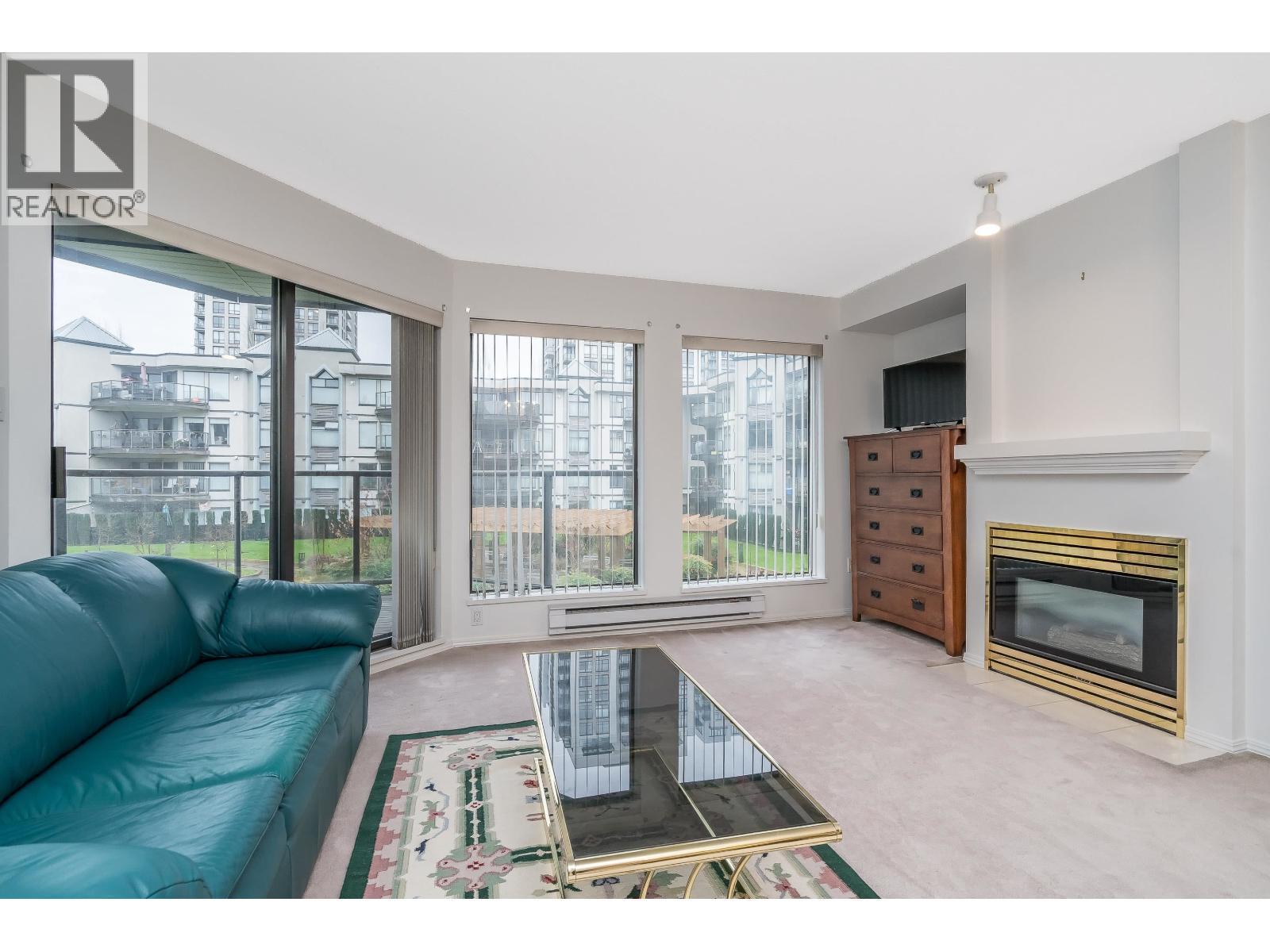 208 2968 Burlington Drive, Coquitlam, BC - Indoor Photo Showing Living Room With Fireplace