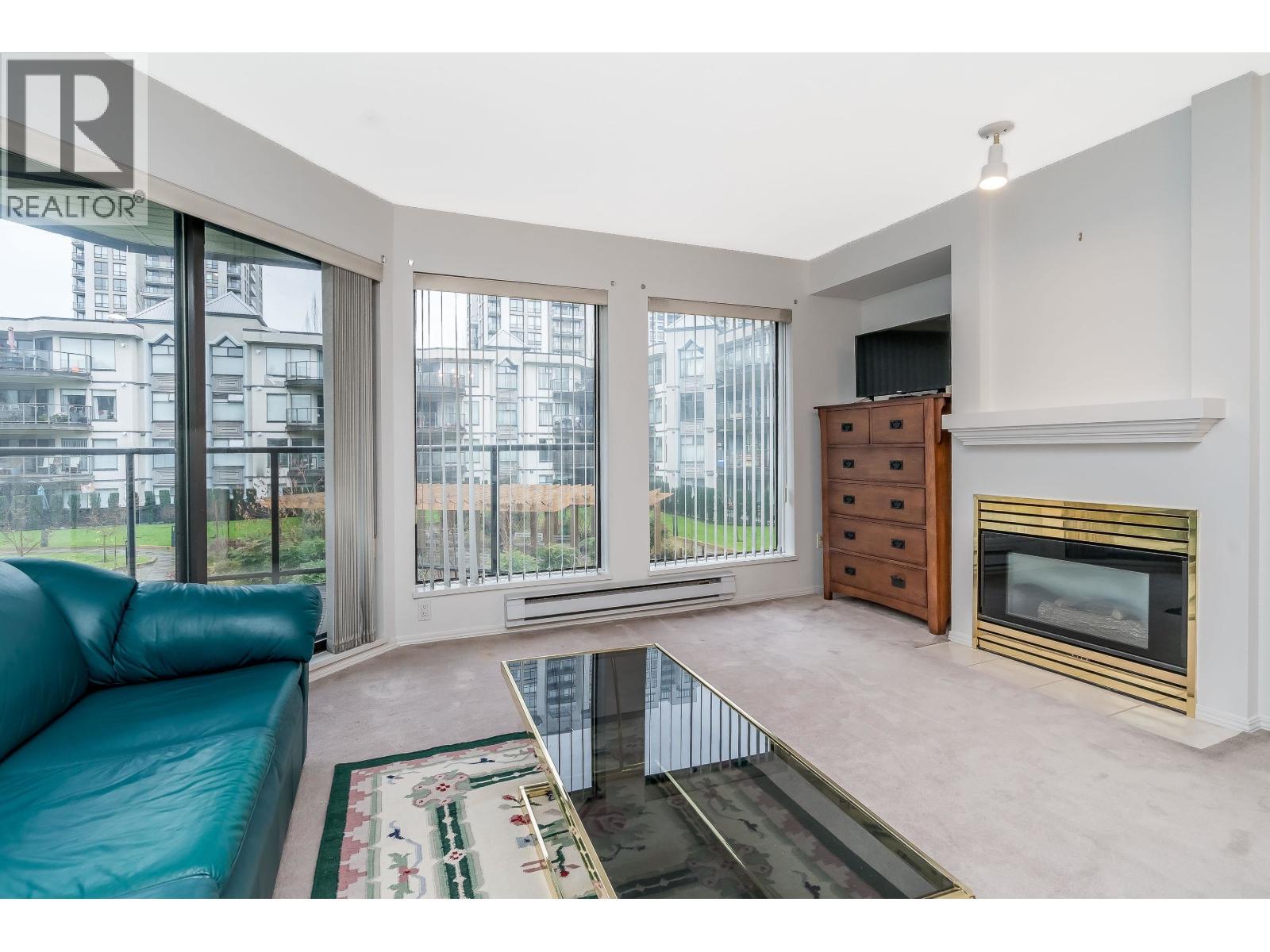 208 2968 Burlington Drive, Coquitlam, BC - Indoor Photo Showing Living Room With Fireplace