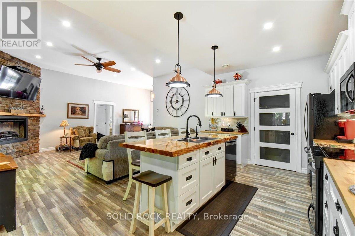 400 Pigden Road, Madoc, ON - Indoor Photo Showing Kitchen With Fireplace With Double Sink With Upgraded Kitchen