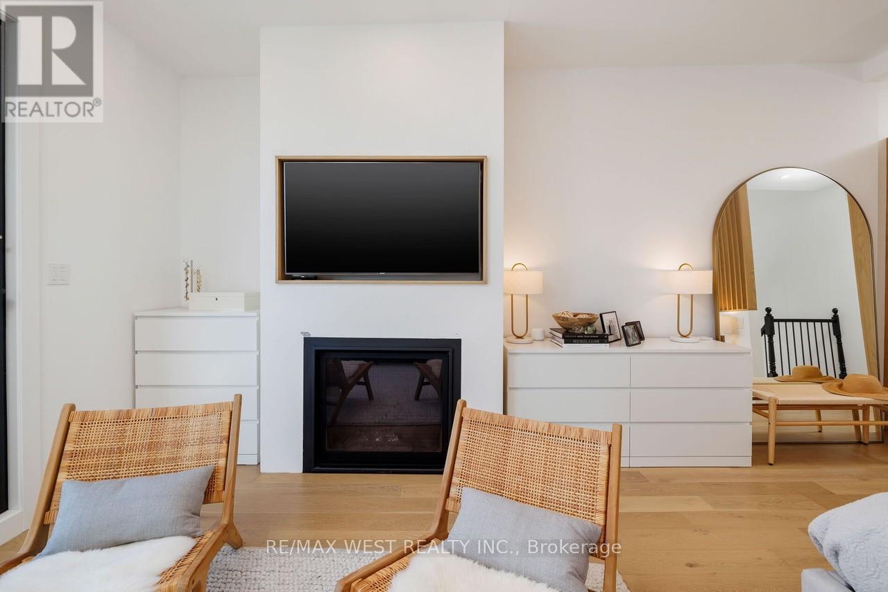 22 Cowan Avenue, Toronto, ON - Indoor Photo Showing Living Room With Fireplace