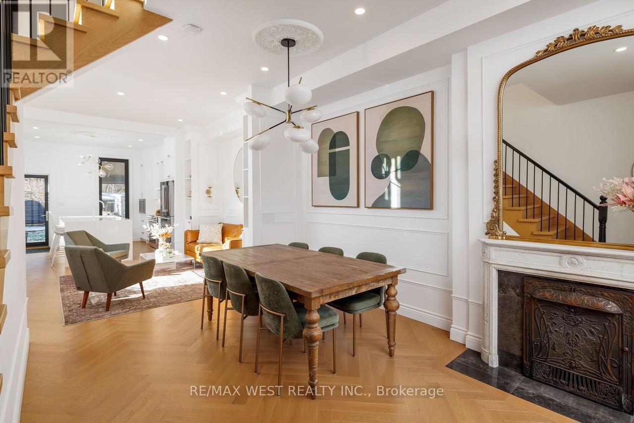 22 Cowan Avenue, Toronto, ON - Indoor Photo Showing Dining Room With Fireplace