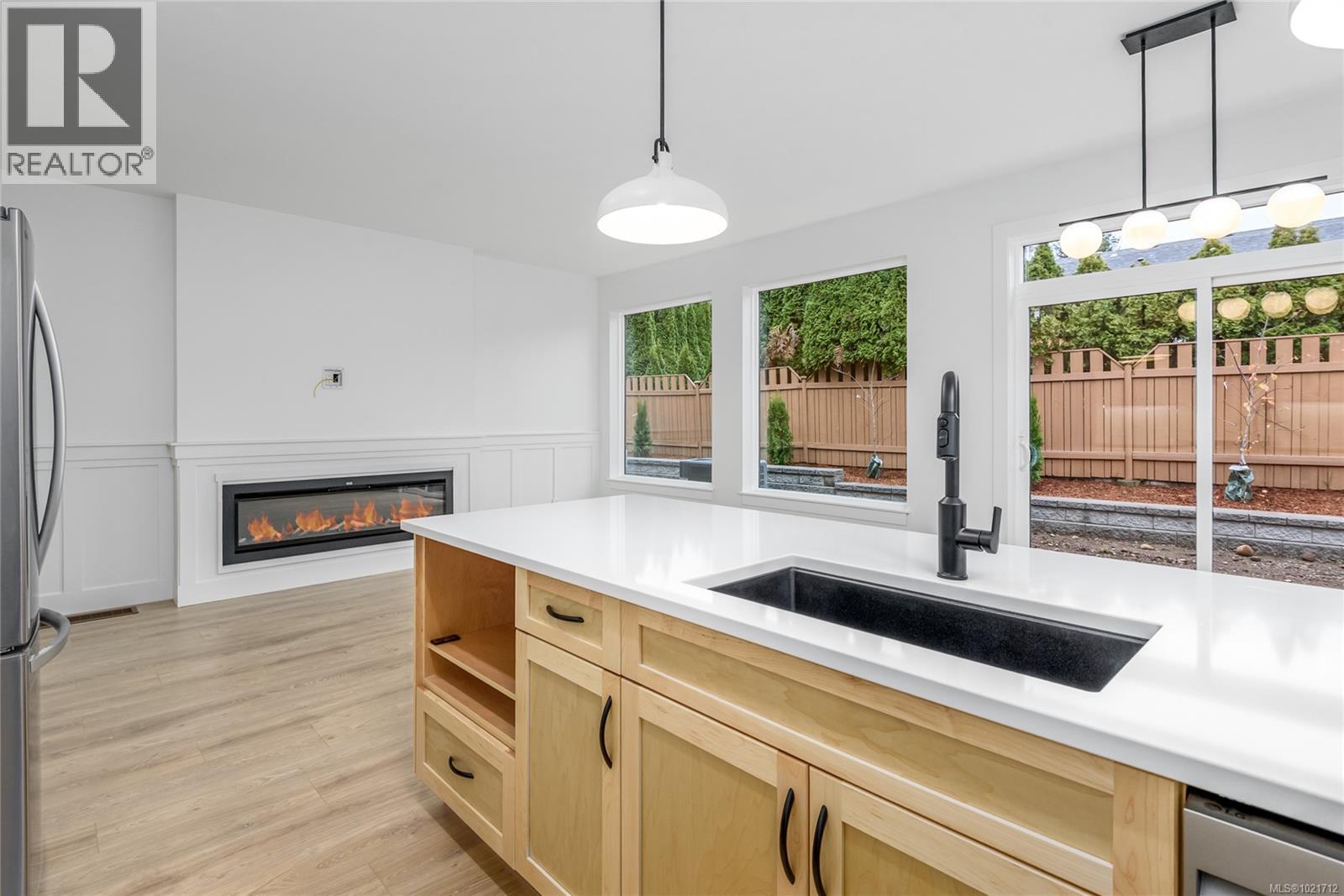 B 1044 Lazo Rd, Comox, BC - Indoor Photo Showing Kitchen With Fireplace