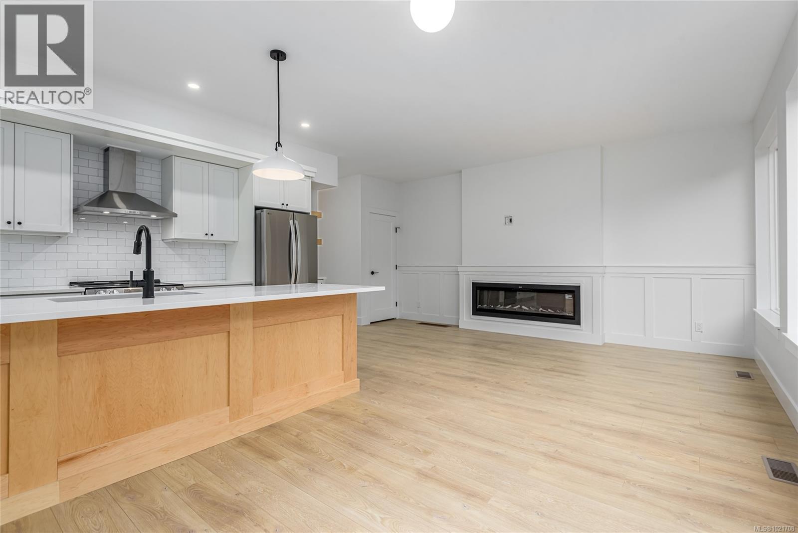 A 1044 Lazo Rd, Comox, BC - Indoor Photo Showing Kitchen With Fireplace With Upgraded Kitchen