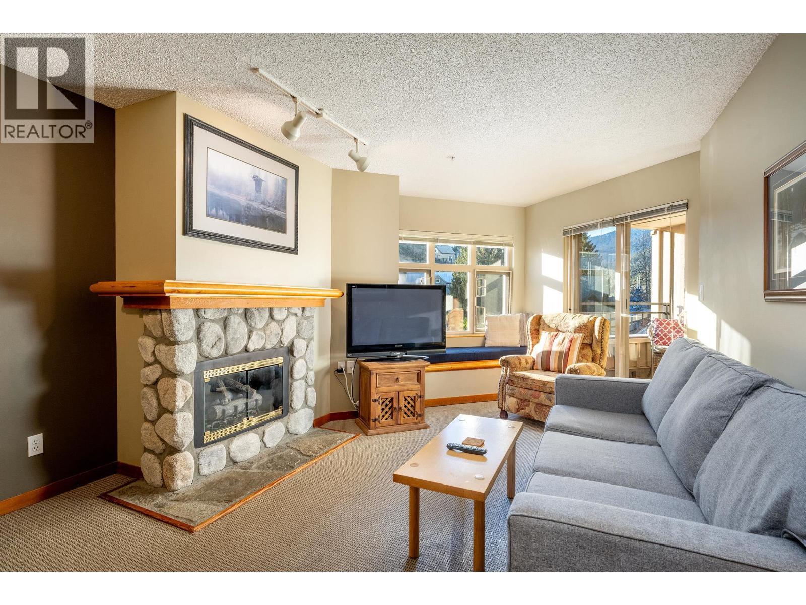 322 2050 Lake Placid Road, Whistler, BC - Indoor Photo Showing Living Room With Fireplace