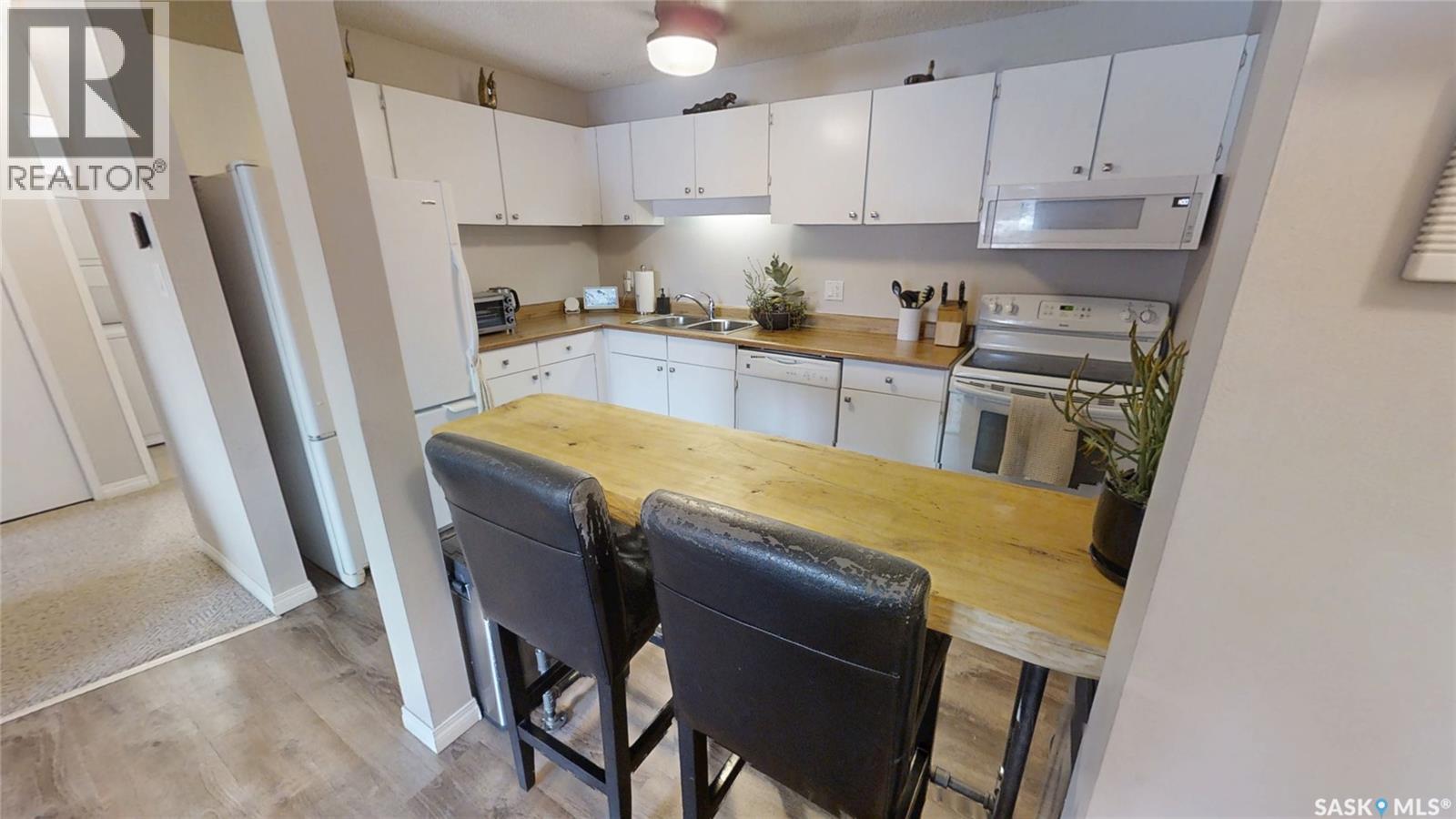201 245 Kingsmere Boulevard, Saskatoon, SK - Indoor Photo Showing Kitchen With Double Sink