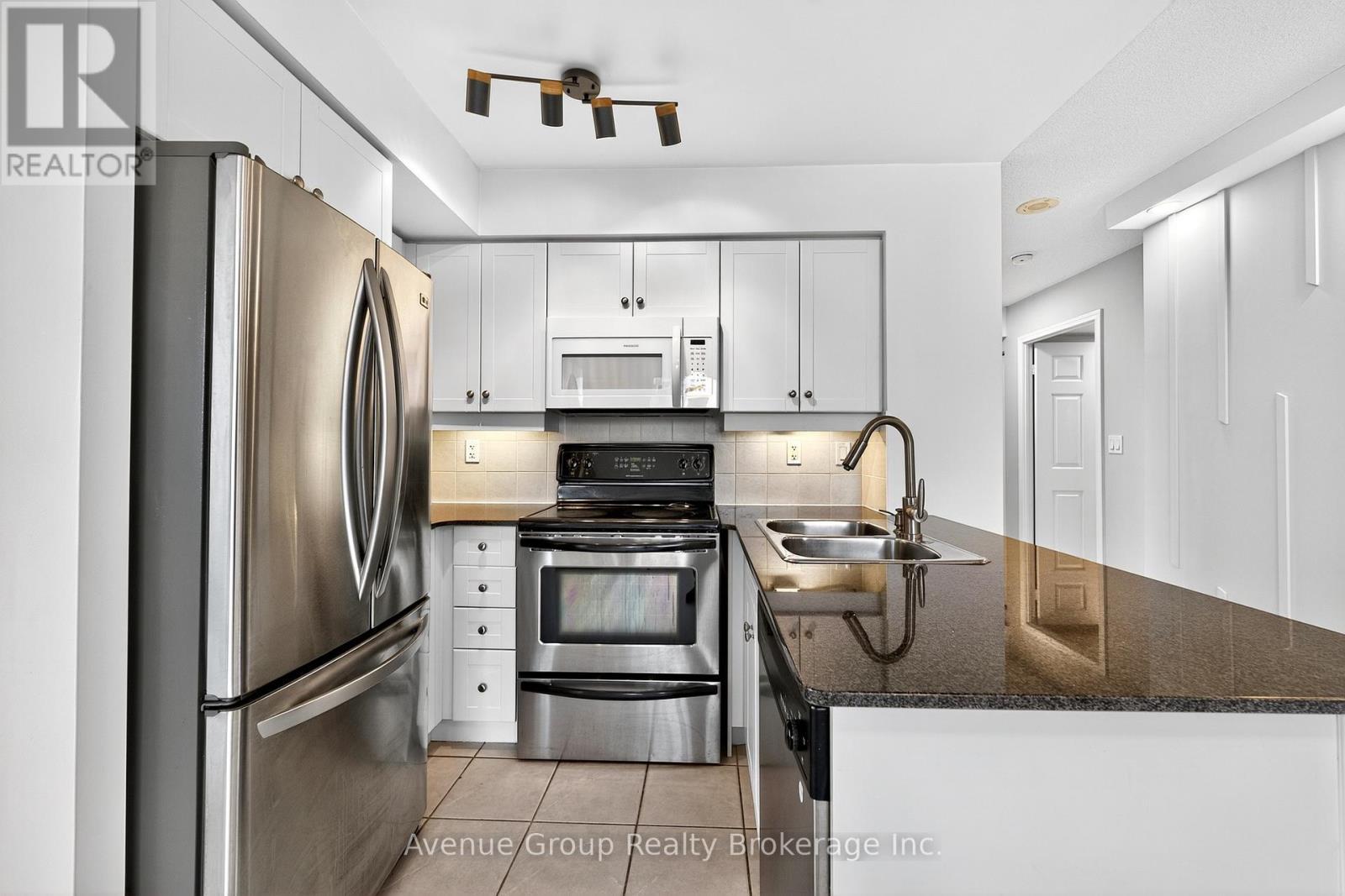 714 - 19 Barberry Place, Toronto, ON - Indoor Photo Showing Kitchen With Double Sink