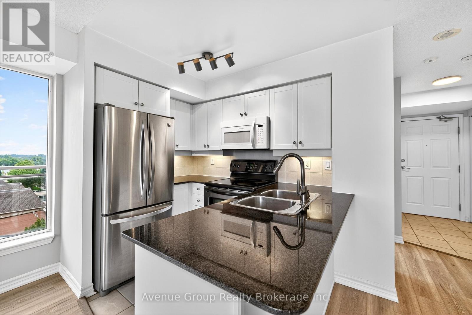 714 - 19 Barberry Place, Toronto, ON - Indoor Photo Showing Kitchen With Double Sink