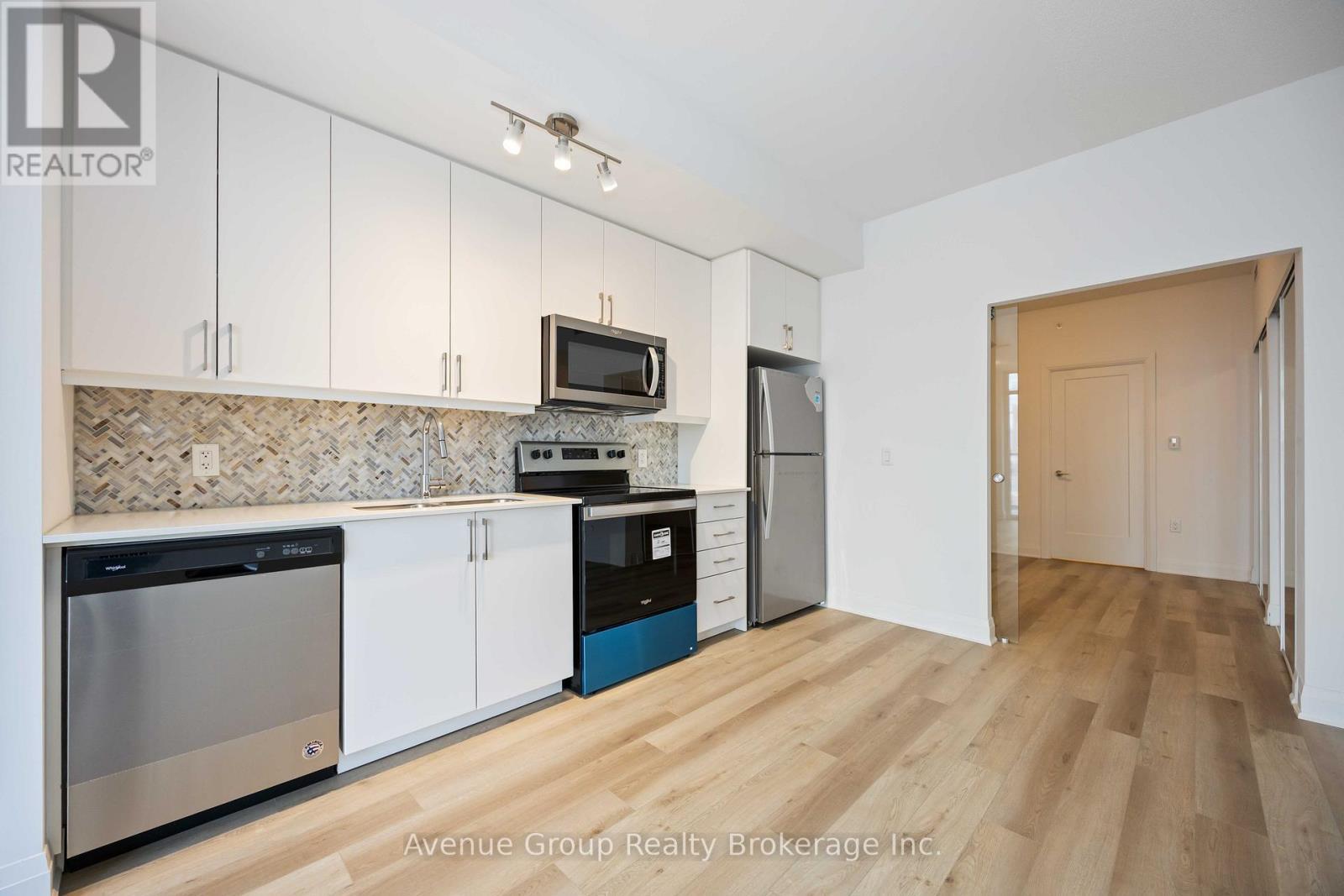 506 - 3220 Sheppard Avenue E, Toronto, ON - Indoor Photo Showing Kitchen With Stainless Steel Kitchen