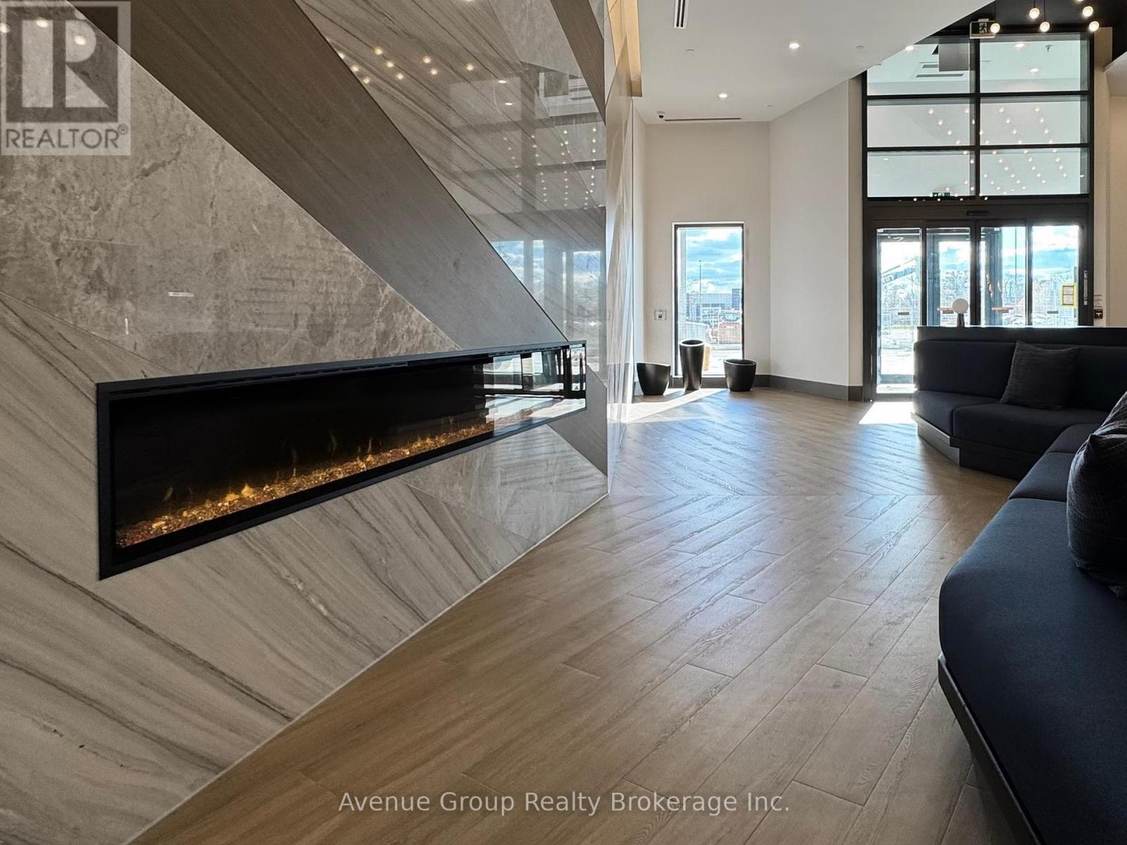 620 - 1037 The Queensway, Toronto, ON - Indoor Photo Showing Living Room With Fireplace