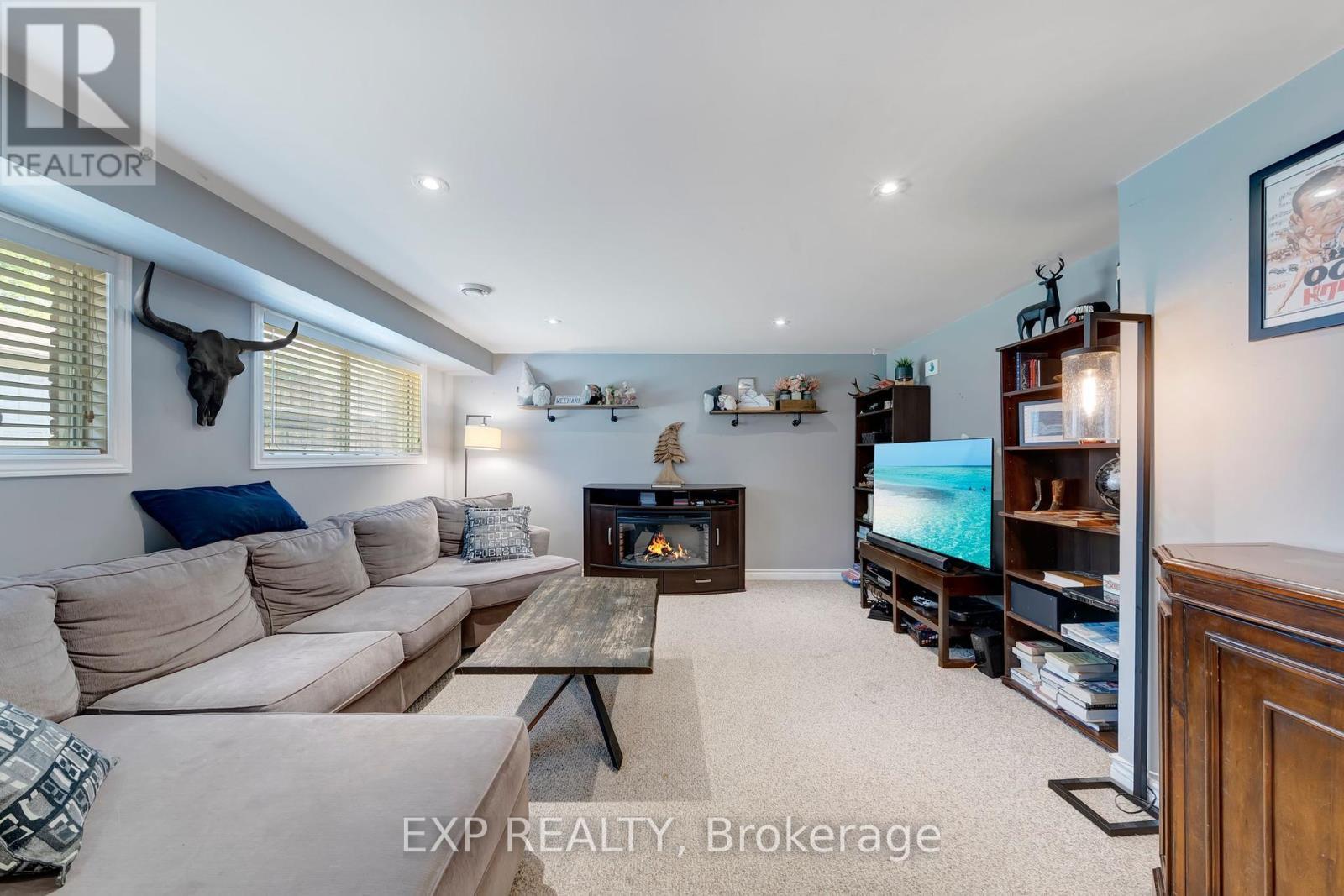 Basement Rec - 25 Ziraldo Road, St. Catharines (Martindale Pond), ON - Indoor Photo Showing Living Room With Fireplace