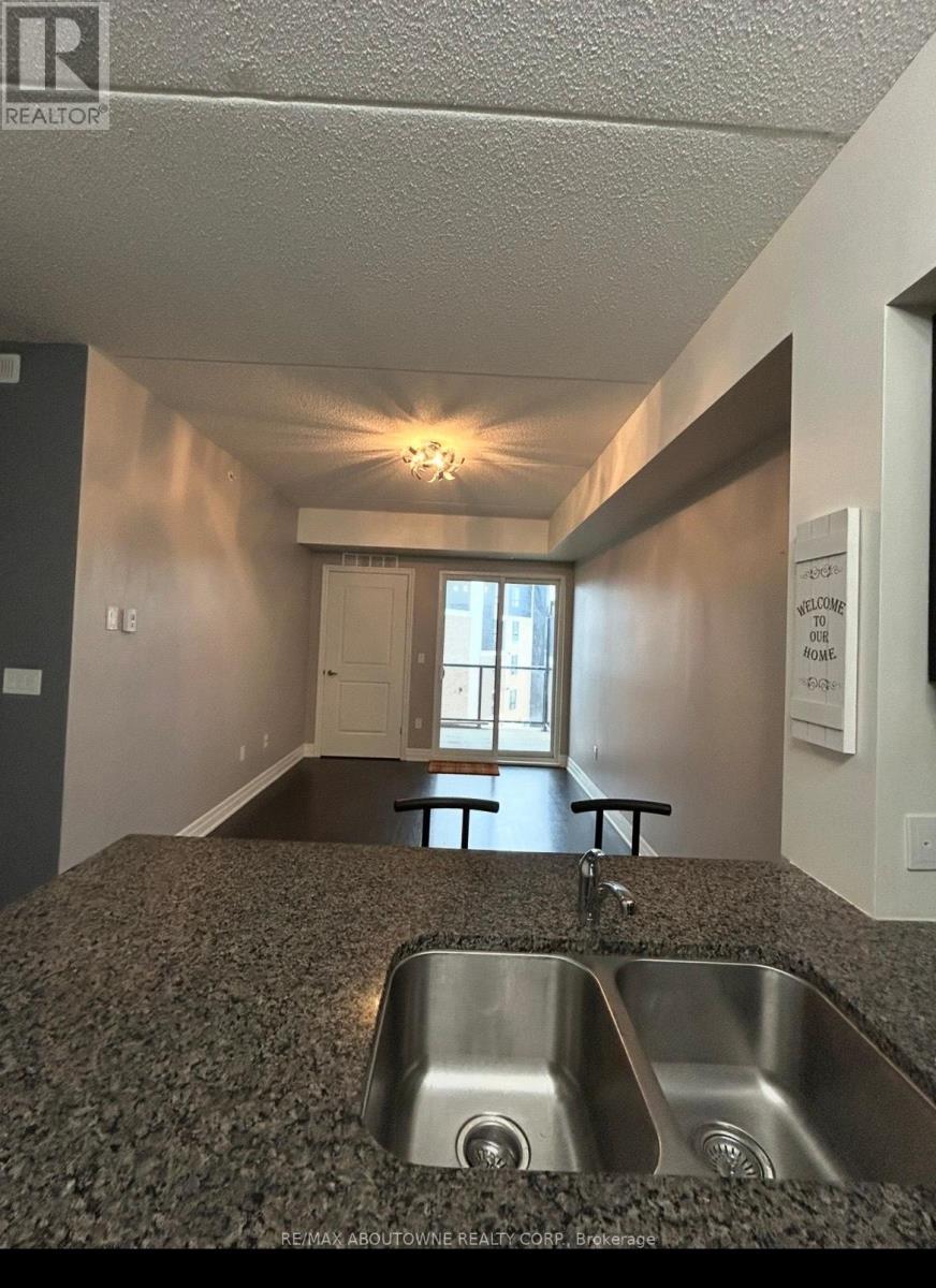 411 - 620 Sauve Street E, Milton, ON - Indoor Photo Showing Kitchen With Double Sink
