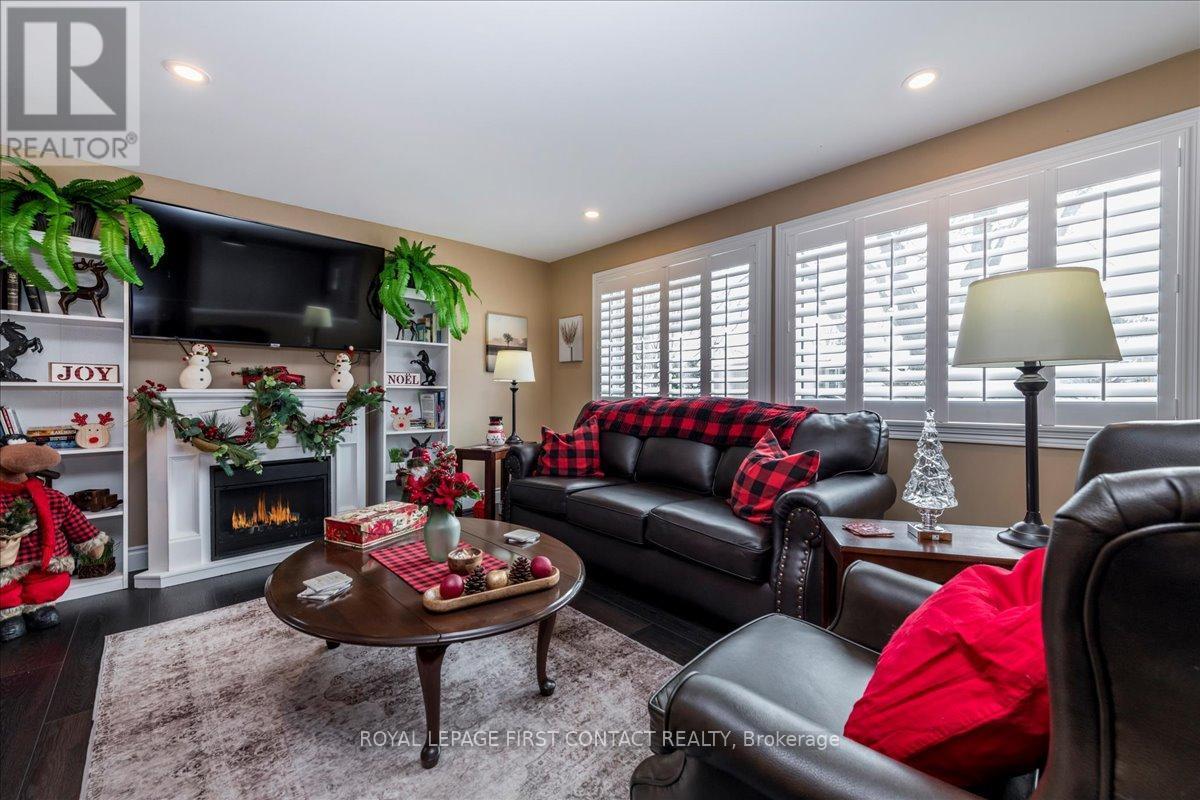 Living room - 10 South Boulevard, Innisfil, ON - Indoor Photo Showing Living Room With Fireplace