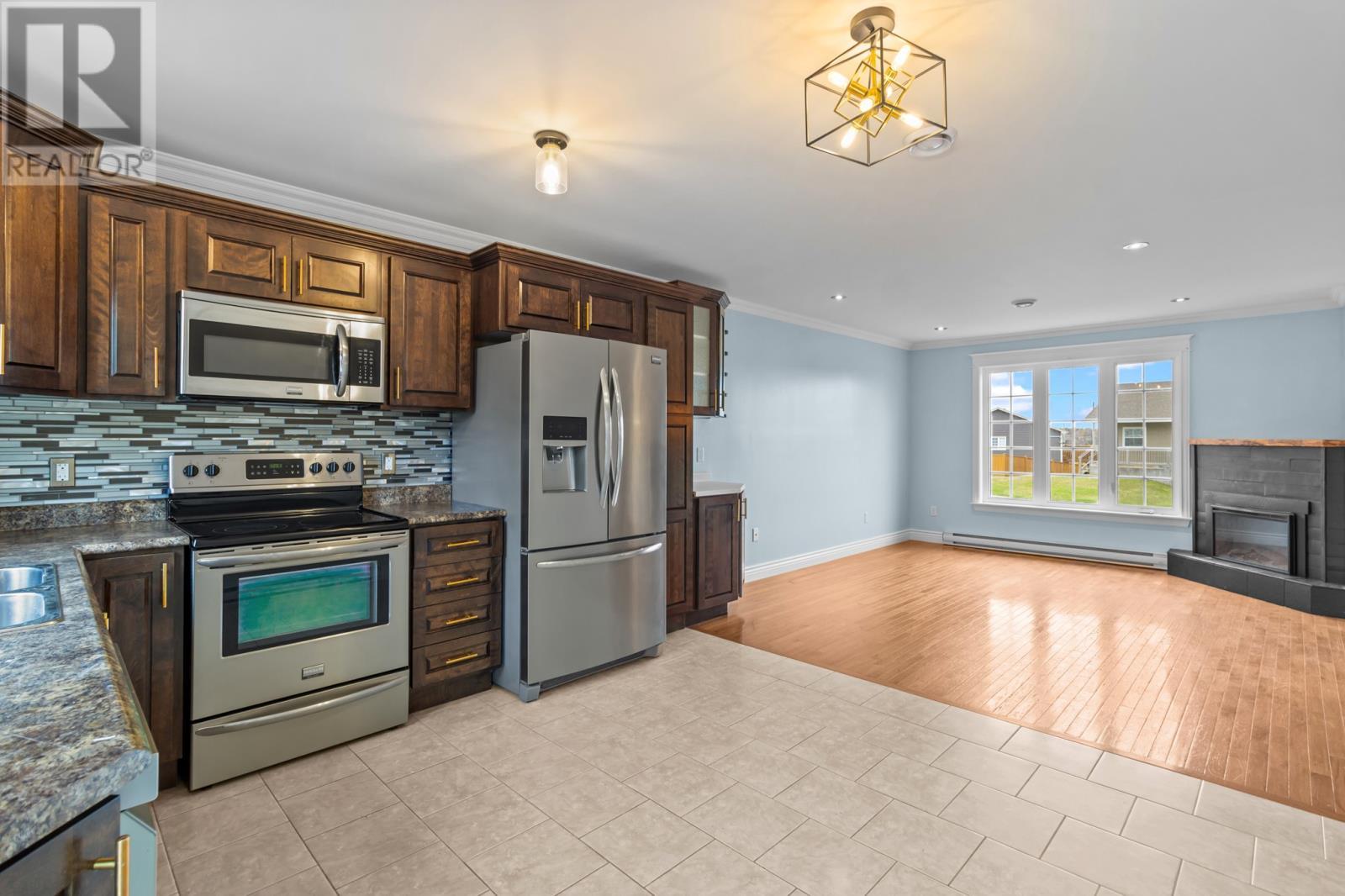87 Cole Thomas Drive, Conception Bay South, NL - Indoor Photo Showing Kitchen With Fireplace