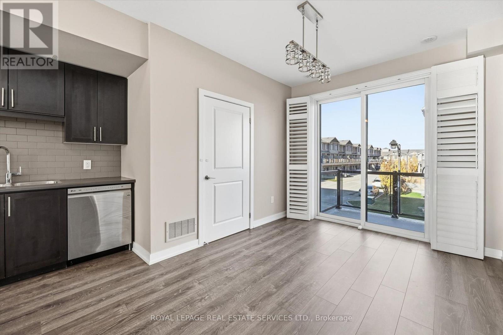 Dining Room with Walkout to a Private Balcony - 85 Esplanade Lane, Grimsby, ON - Indoor Photo Showing Kitchen
