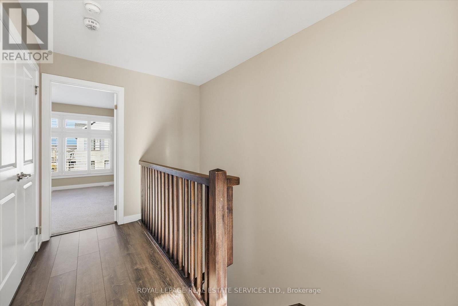Laminate Flooring in the Third Level Hallway - 85 Esplanade Lane, Grimsby, ON - Indoor Photo Showing Other Room