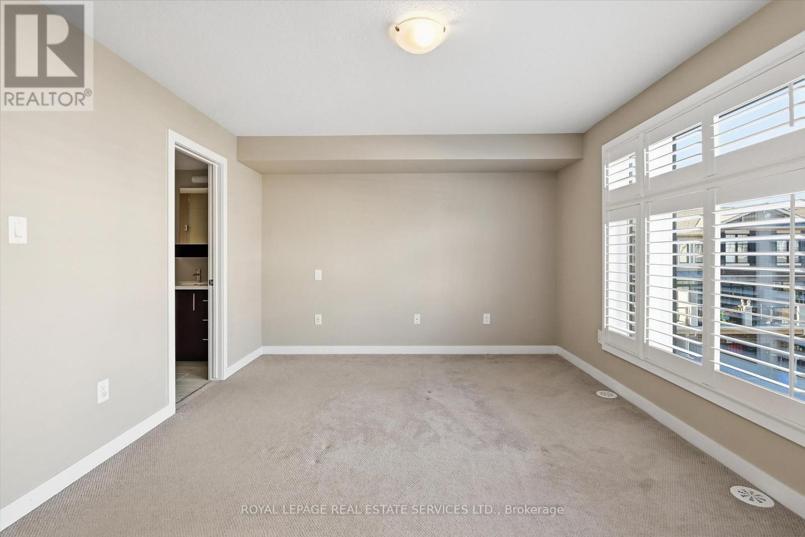 Oversized Primary Retreat with a 3-Piece Ensuite - 85 Esplanade Lane, Grimsby, ON - Indoor Photo Showing Other Room