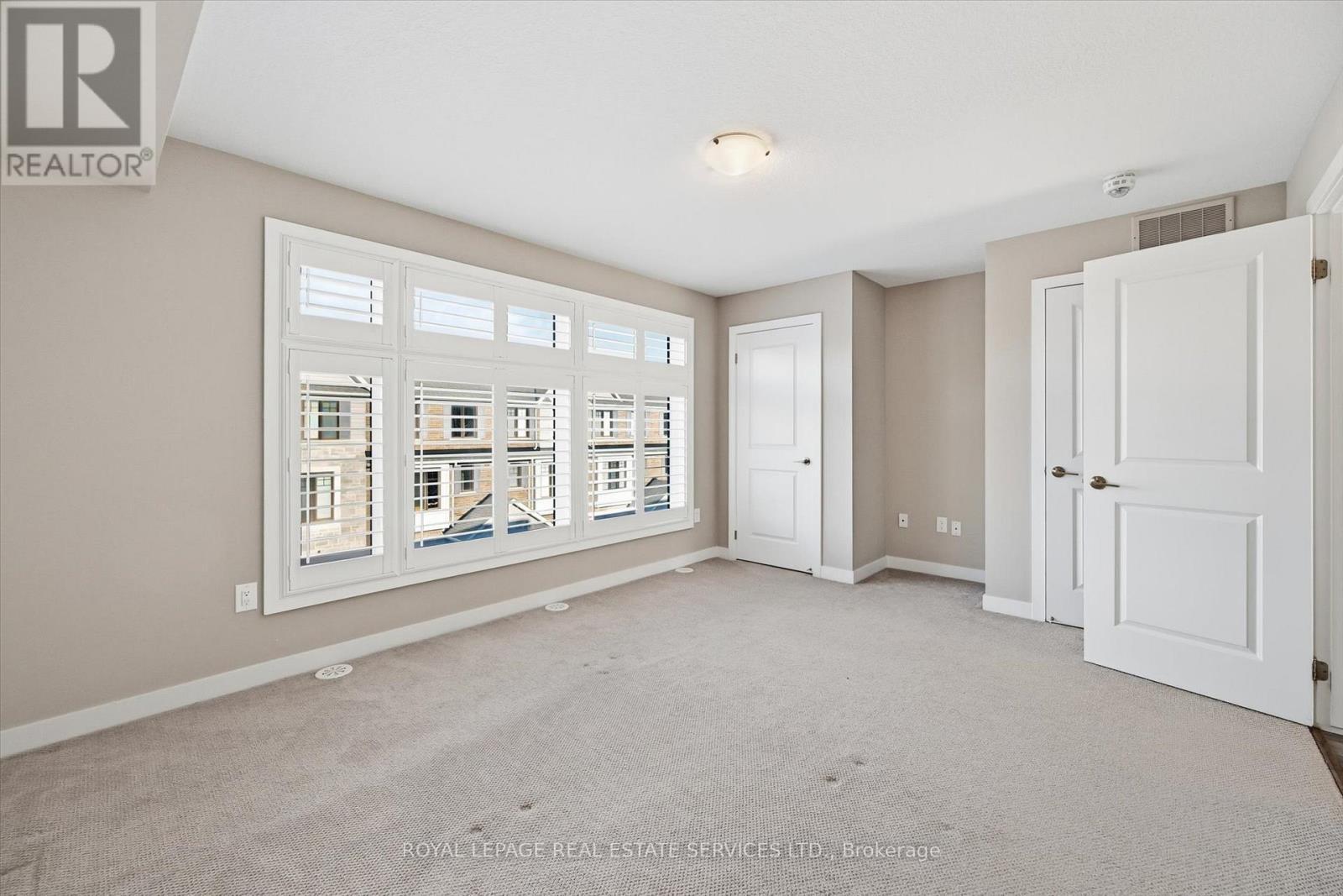 Large Picture Window in Primary Bedroom - 85 Esplanade Lane, Grimsby, ON - Indoor Photo Showing Other Room