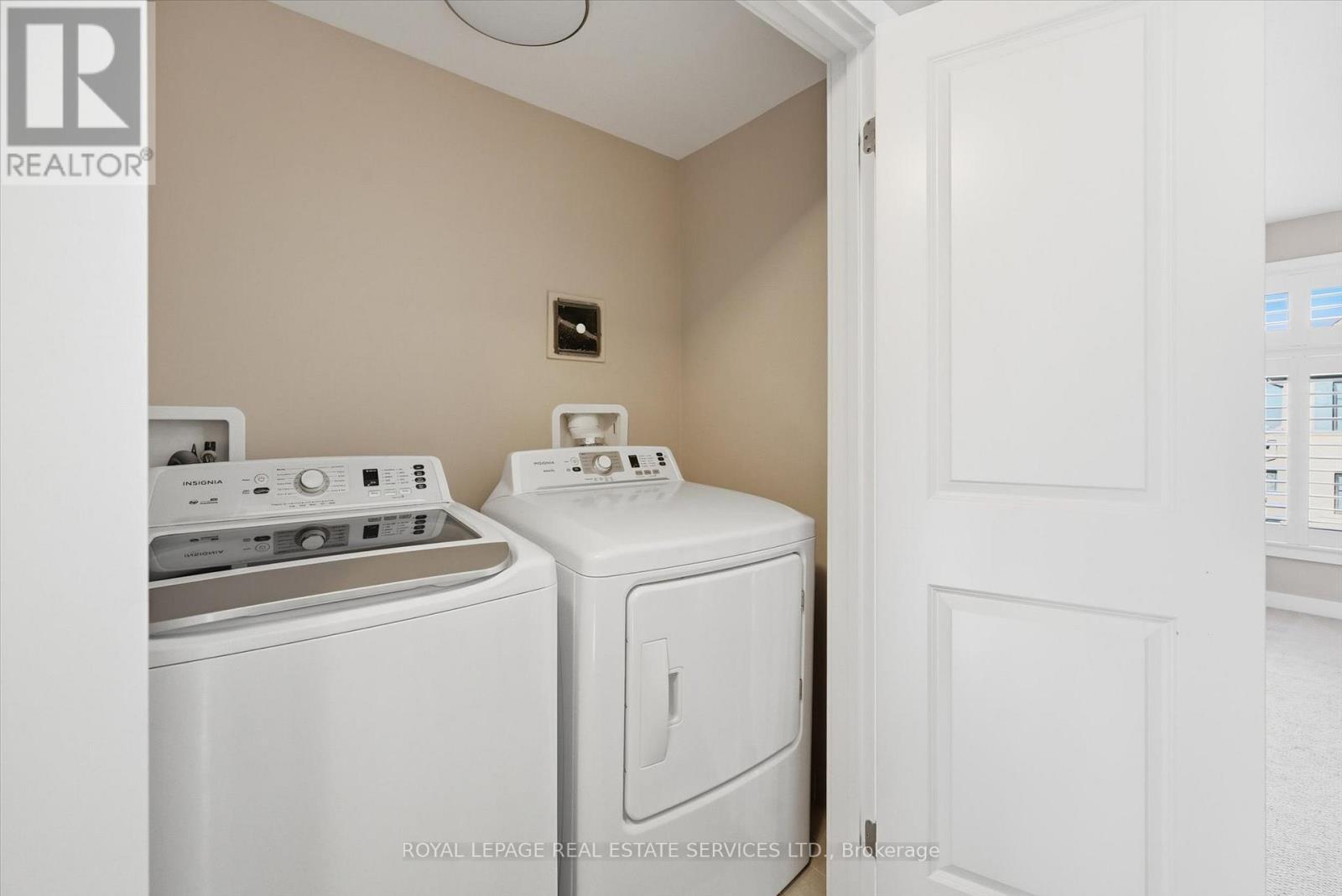 Convenient Laundry Cupboard on the Third Level - 85 Esplanade Lane, Grimsby, ON - Indoor Photo Showing Laundry Room