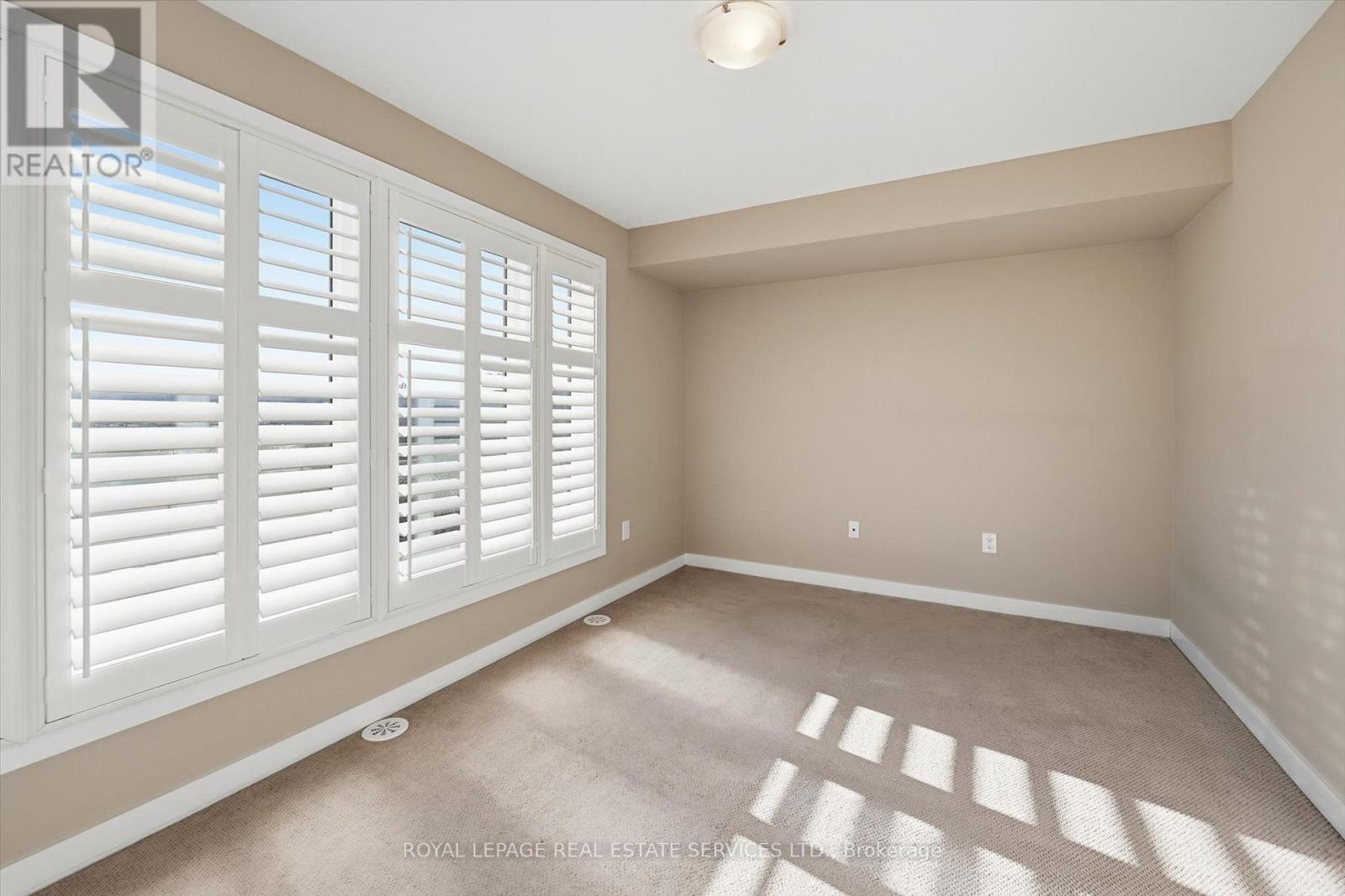 Generous Second Bedroom with Plush Broadloom - 85 Esplanade Lane, Grimsby, ON - Indoor Photo Showing Other Room